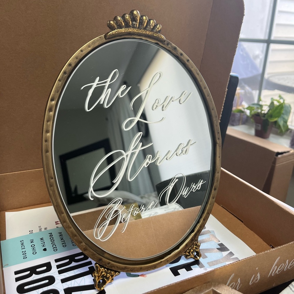 Gold Oval Mirror with Script Design